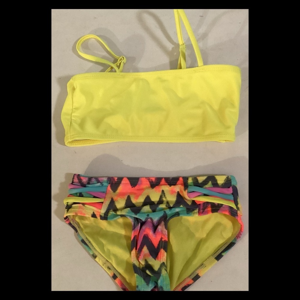 Little girl, yellow top floral bottom, two piece swimsuit. 10